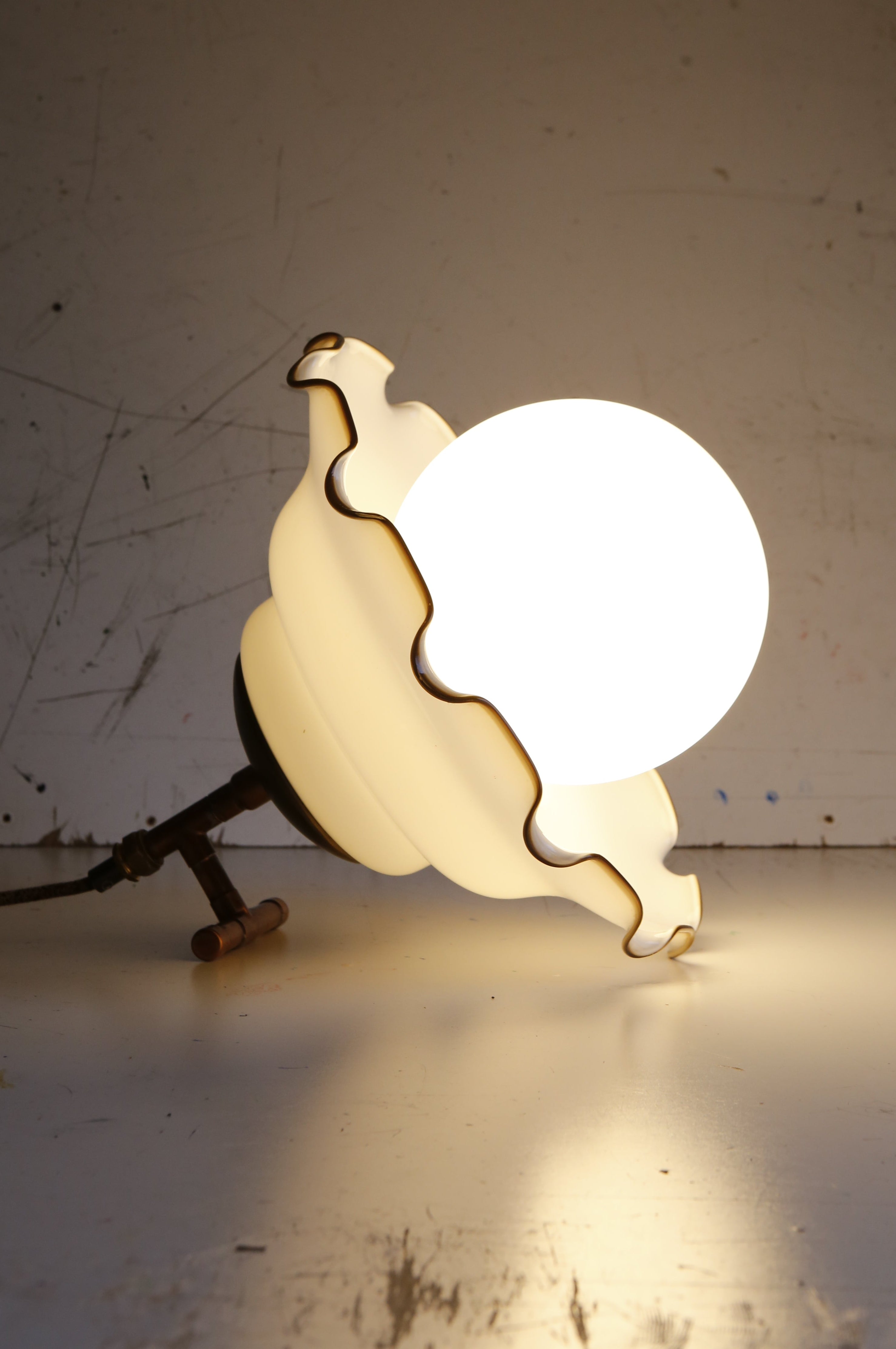 Decorative lamp with a unique design on a plain background