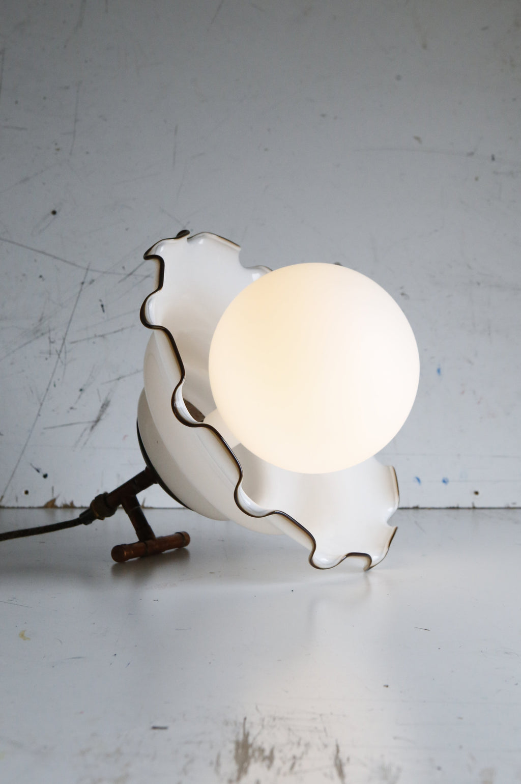 white glass shade turned into table lamp with extra large white bulb