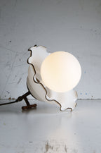 white glass shade turned into table lamp with extra large white bulb