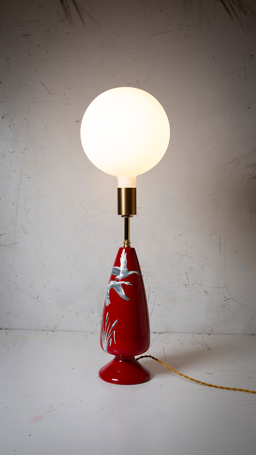 vintage crown devon ceramic table lamp with white porcelain globe bulb on a white industrial backgrounding 