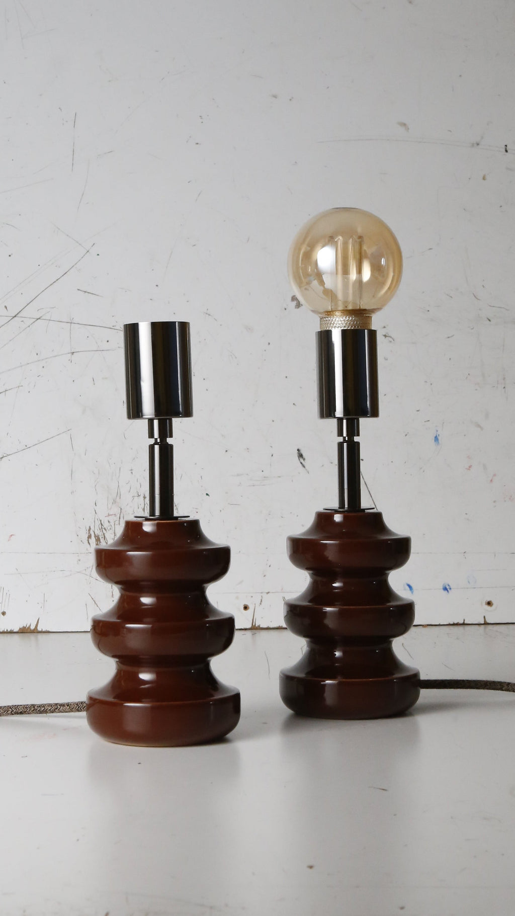 vintage table lamps of which there's that have been reimagined, adding contemporary gloss black lamp holder and cotton covered cable