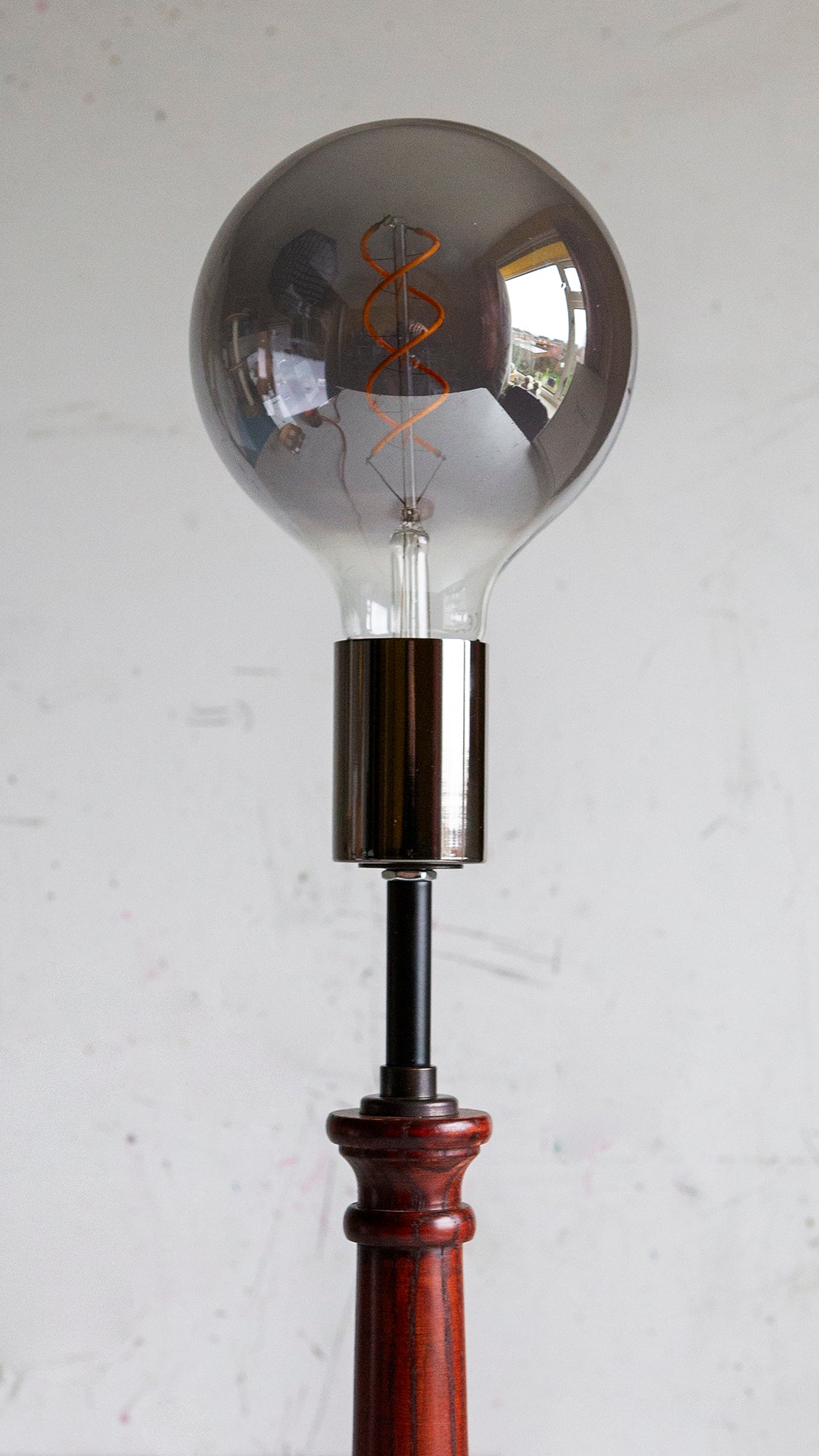 Vintage-style light bulb against a white background