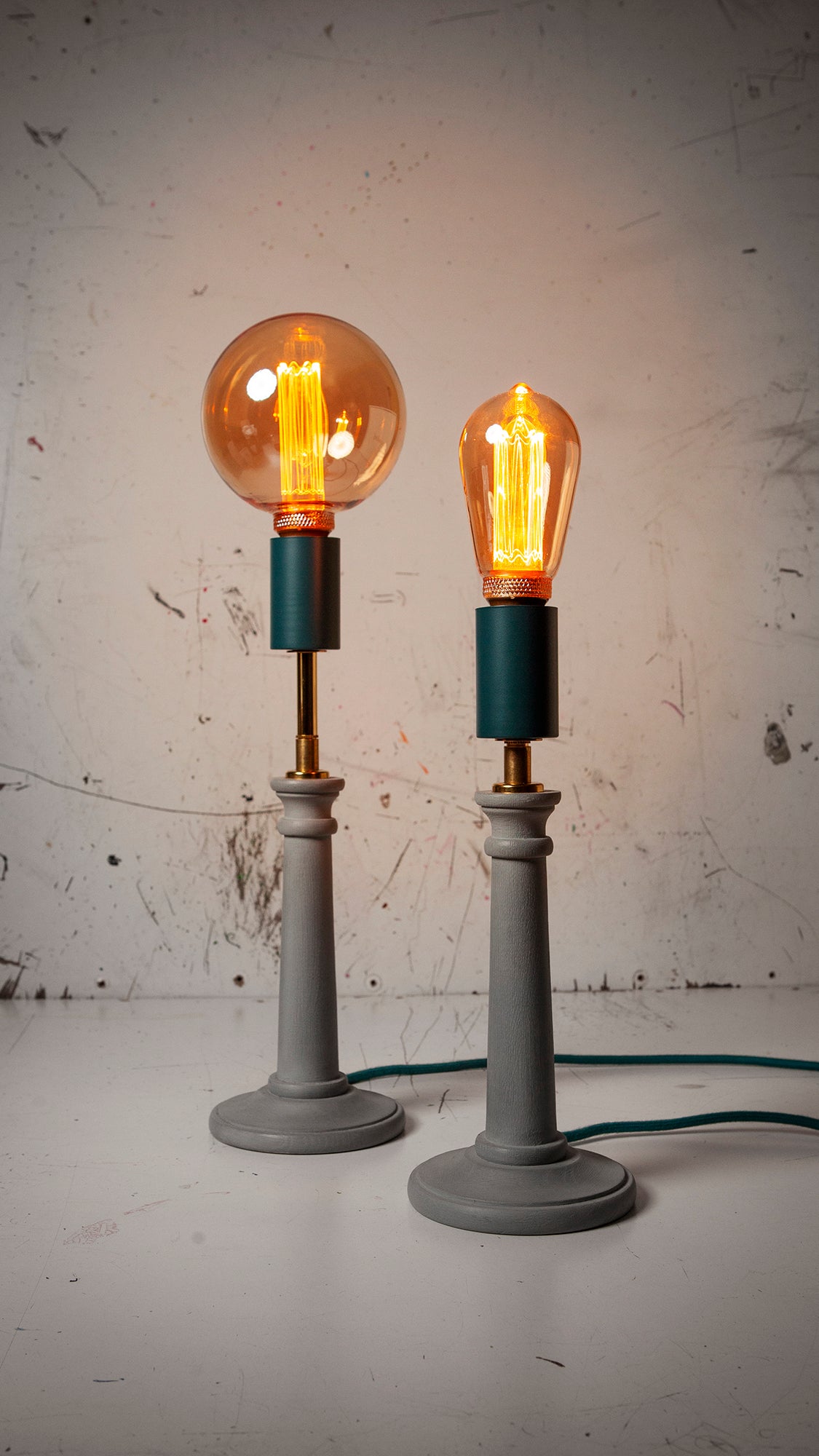 g95 & 125 squirrel cage led bulbs on industrial background