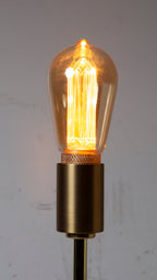 Vintage-style light bulb with a metallic base on a plain background