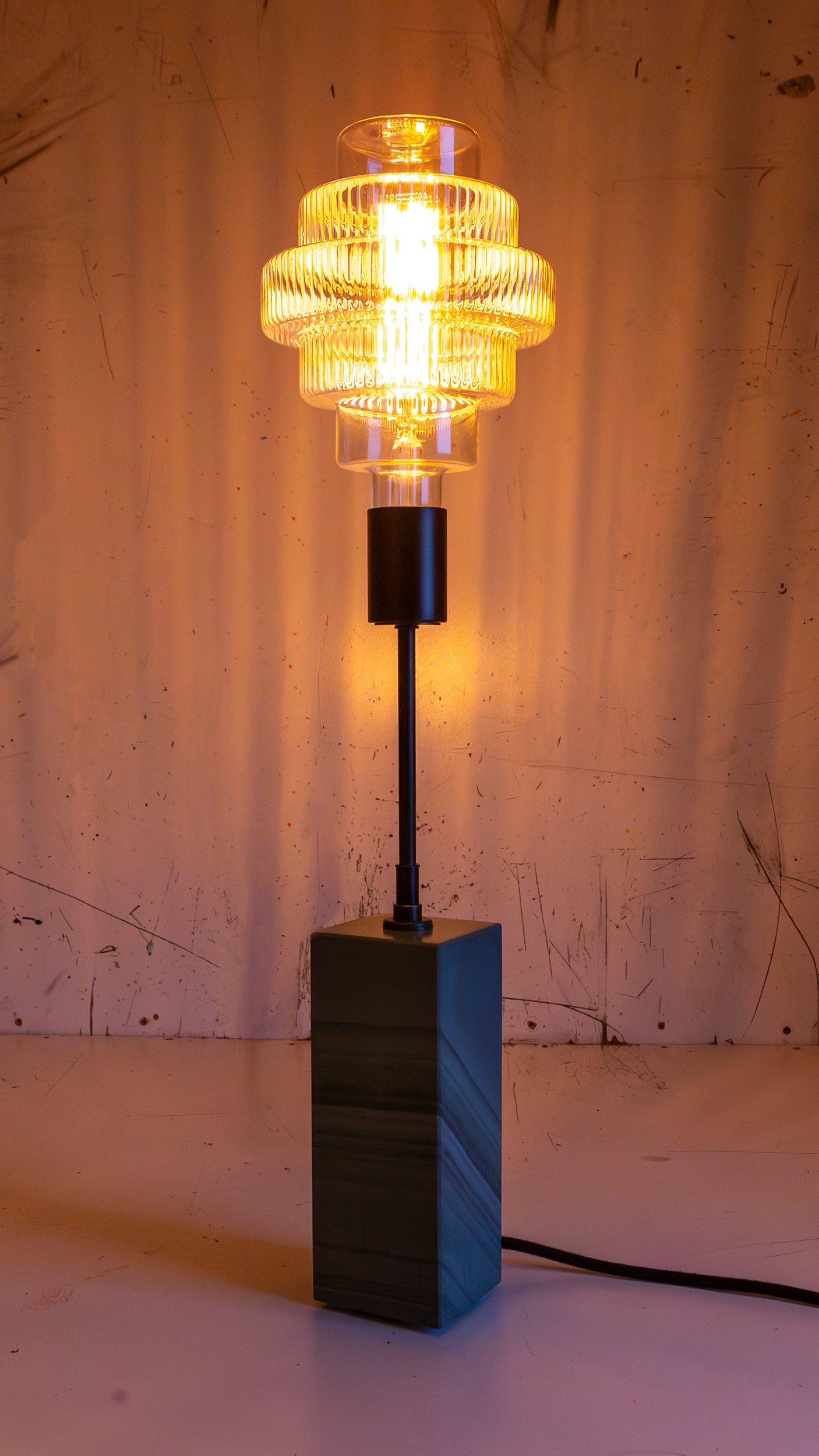 Gorgeously heavy solid slate / stone base reimagined with a 6 inch extension and matt black lamp holder & black cotton cable