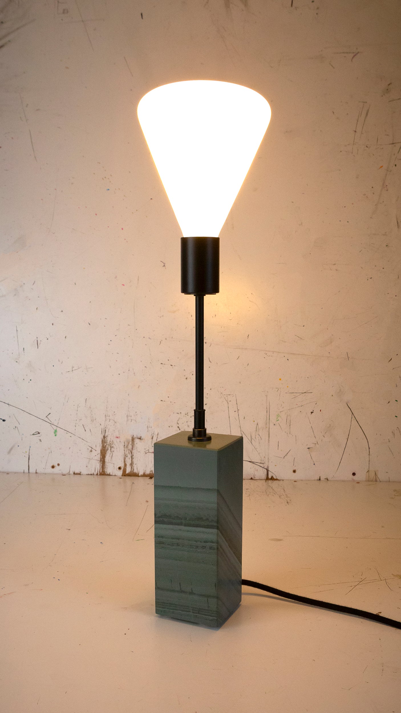 Gorgeously heavy solid slate / stone base reimagined with a 6 inch extension and matt black lamp holder & black cotton cable