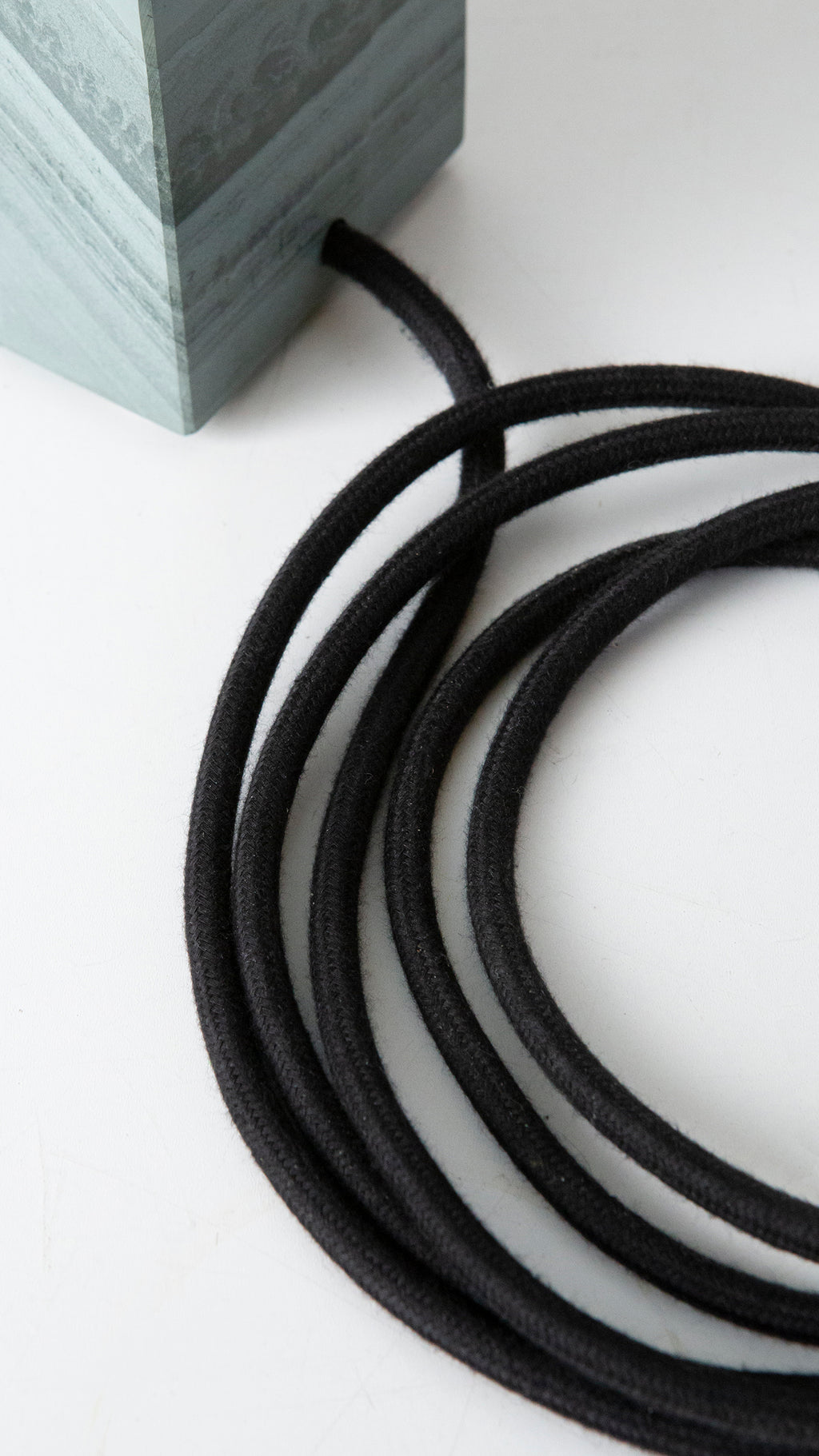 Gorgeously heavy solid slate / stone base reimagined with a 6 inch extension and matt black lamp holder & black cotton cable