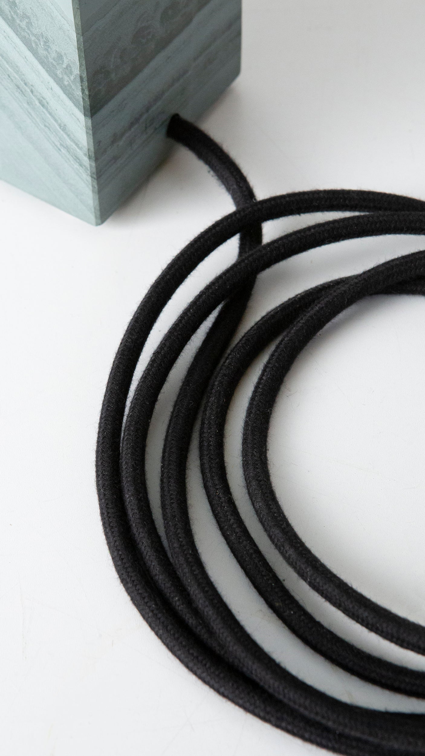 Gorgeously heavy solid slate / stone base reimagined with a 6 inch extension and matt black lamp holder & black cotton cable