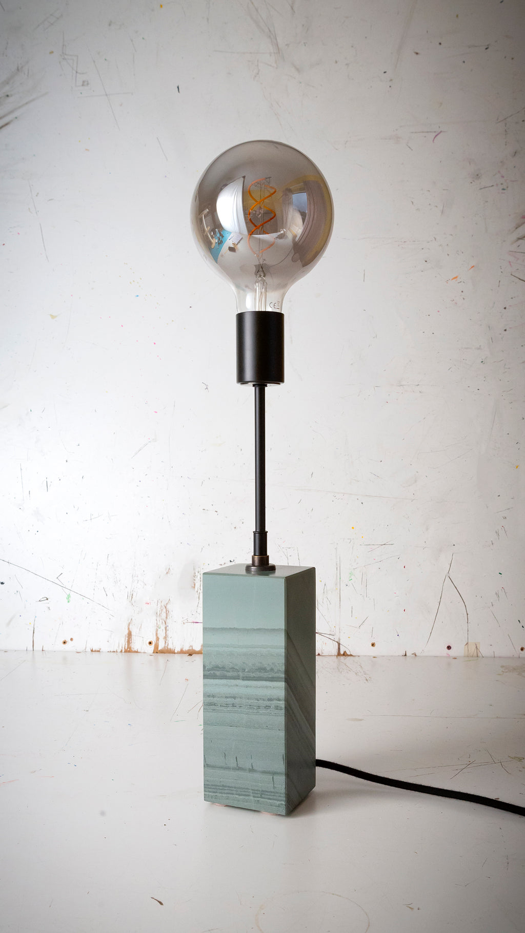 Gorgeously heavy solid slate / stone base reimagined with a 6 inch extension and matt black lamp holder & black cotton cable